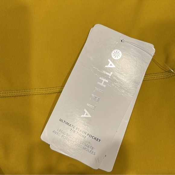 BAG361. NWT Athleta Ultimate Stash 7/8 Long side
Pockets Golden Mustard Leggings - Picture 5 of 6